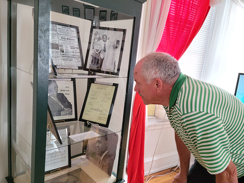 John Nolan eyes memorabilia from Paul Robeson's transatlantic concert.