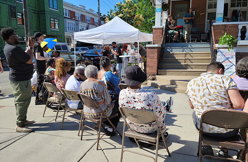 The audience enjoys the performance by Omar's Hat during Porchfest 2022 at the Paul Robeson House & Museum, June 4, 2022.