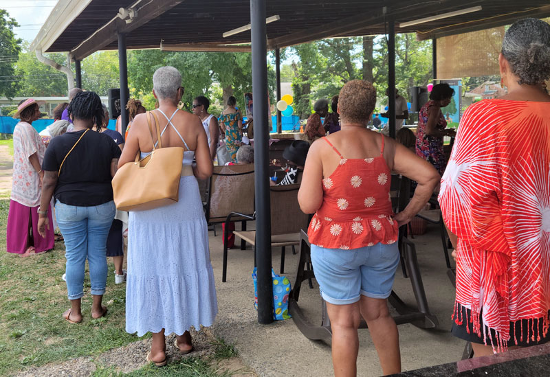 Fans line up to meet author Diane McKinney-Whetstone and have their books signed. Photo by Sherry L. Howard