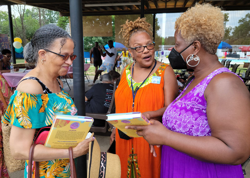 Janice Sykes Ross (center), executive director of the Paul Robeson House & Museum, with fans Gloria Temple Epperson (left) and Angela Simmons Smith (right). Photo by Sherry L. Howard.
