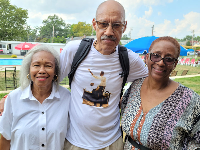 Fans of author Diane McKinney Whetstone. From left, Jill Mathis, who used to come to the swim club for parties as a teenager; photographer Raymond W. Holman Jr. and Paula Lamb. Holman will be presenting his photography and giving a talk at the Paul Robeson House &amp; Museum as part of its "Arts in the Parlor" program on Sunday, Sept. 25, 2022, at 3 pm. Visit the Robeson website at paulrobesonhouse.org for more info. Photo by Sherry L. Howard.