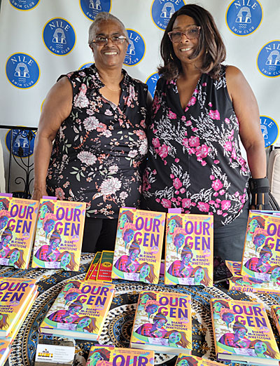 Yvonne Blake (left), owner of Hakim's Bookstore and daughter of its founder, and her daughter Angela Butler with copies of "Our Gen." Photo by Sherry L. Howard. 