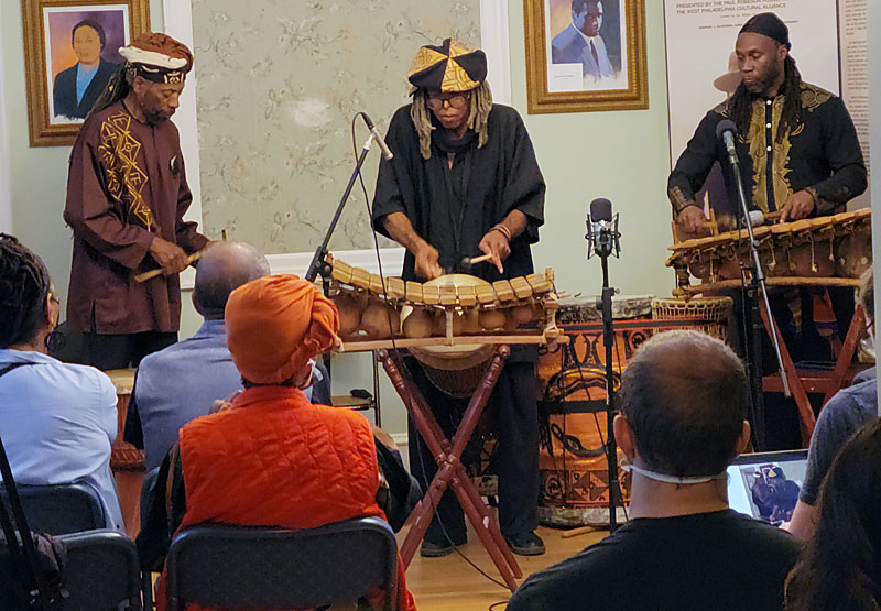 Zumbi Soweto, center, on balafon; Ogunkemi, left with gankogui, or iron bell, and right, Julani Ghana on balafon.