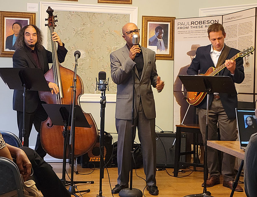 Kevin Valentine sings as Jordan Berger (left) accompanies him on bass and Greg Snyder on guitar. The Velvet Swing Trio performed at the Paul Robeson House & Museum on Sunday, Oct. 23, 2022. Photos by Sherry L. Howard.