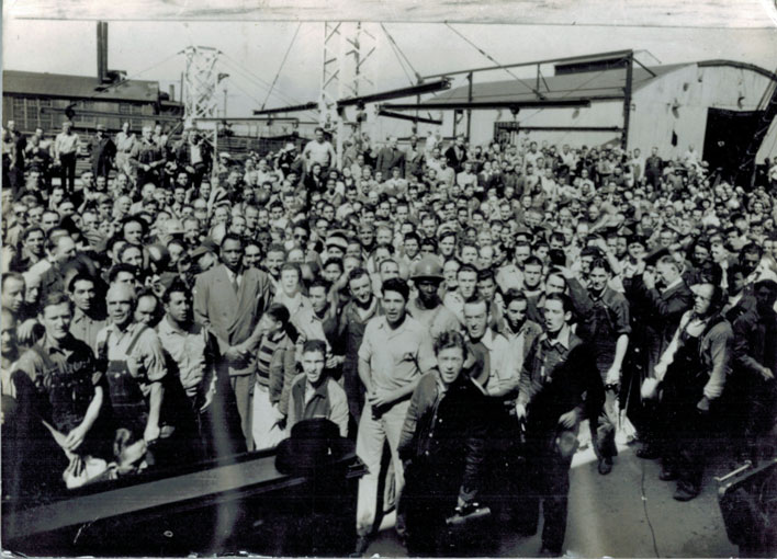 man sings to dock workers