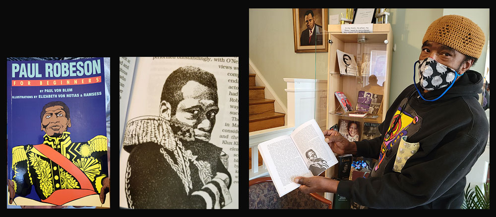 Artist Ramsess with Robeson books that he illustrated.  