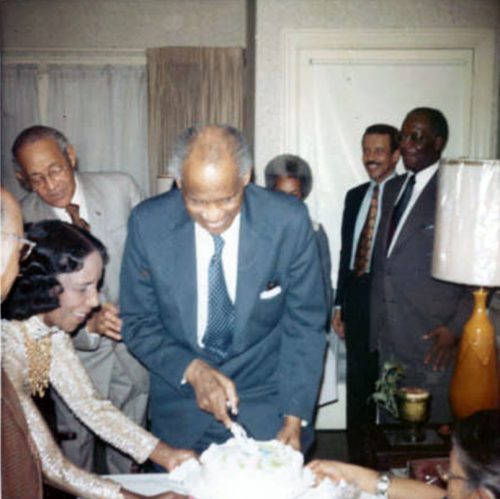 man cutting birthday cake